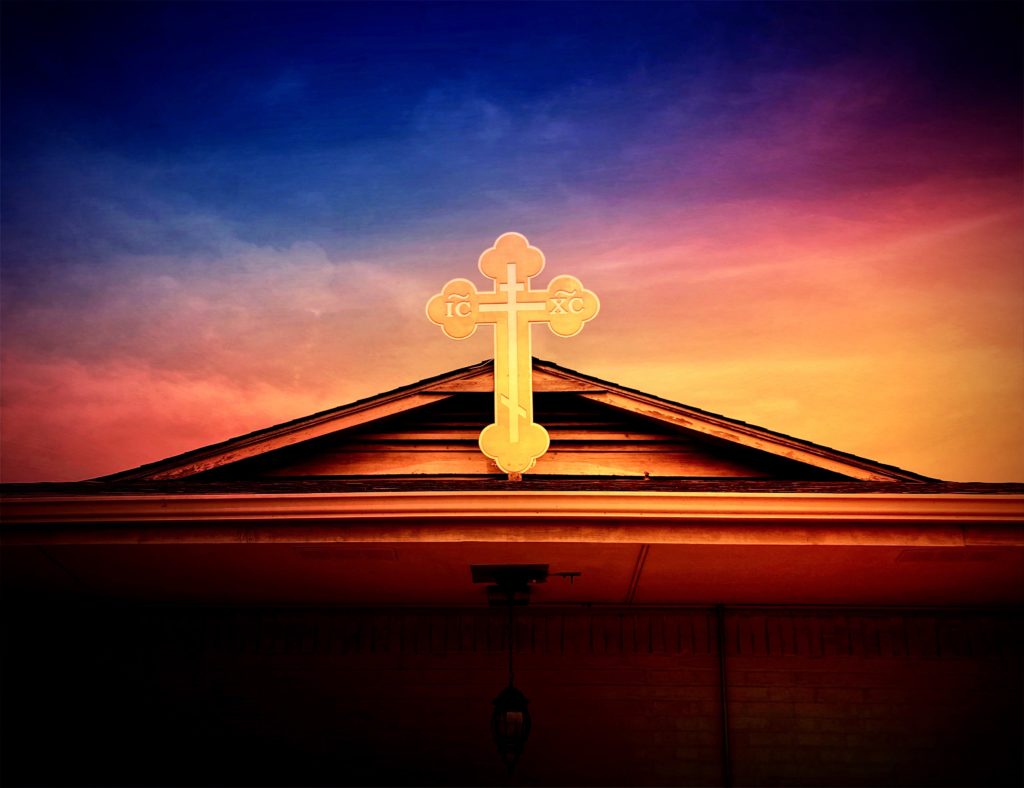 Cross on top of the St. Michael Orthodox Church in Huntsville, Alabama at sunset.